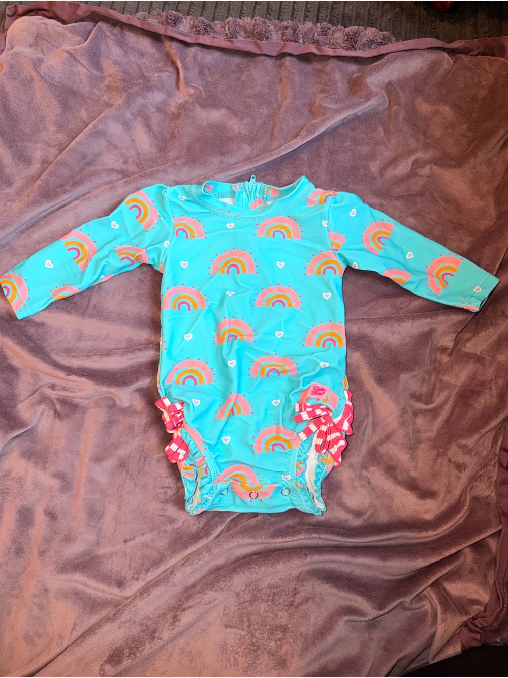 Ruffle Butts rainbow rashguard